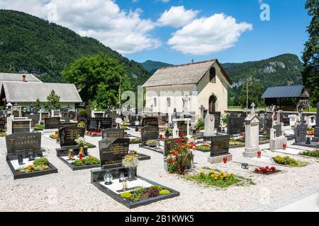 Bohinjska Bistrica, Slovenia – July 7, 2016. Graveyard by the Church of St. Nicholas in Bohinjska Bistrica. Stock Photo