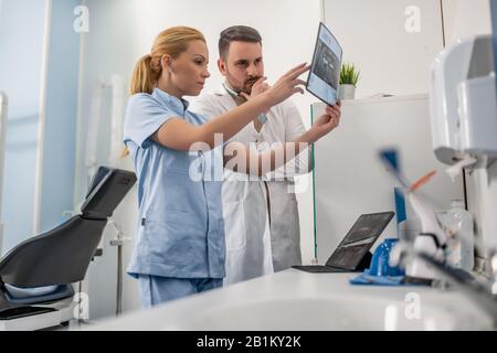 Image of two doctors looking at x-ray.Healthcare, medical and people concept. Stock Photo