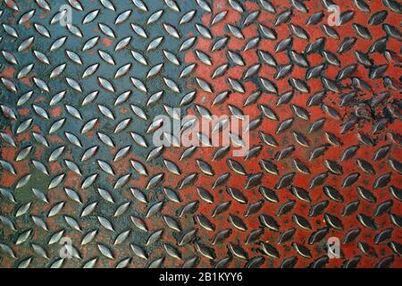 red hard chrome diamond plate pattern for backgorund and texture. material design Stock Photo