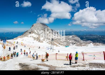 Ramsau am Dachstein, Austria – July 10, 2016. Dachstein Glacier in Austria, with people and Hoher Gjaidstein mountain (2,794m) in the background, in s Stock Photo