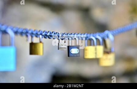 love padlocks hanged on a chain image Stock Photo
