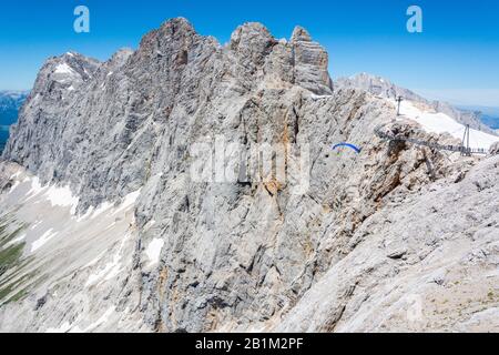 Ramsau am Dachstein, Austria – July 10, 2016. Mountainous landscape with the Suspension Bridge overlook of Dachstein Skywalk in Austria. Stock Photo