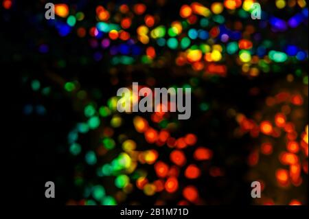 Colored lights out of focus, blurred lights of the street. Stock Photo