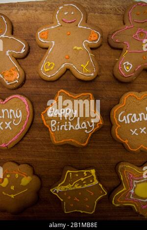 Baked gingerbread men and stars with icing decorations Stock Photo