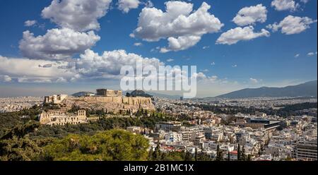 Athens, Greece. Acropolis and Parthenon temple, top landmark. Scenic view of ancient Greece remains from Philopappos Hill. Urban cityscape of Athens, Stock Photo