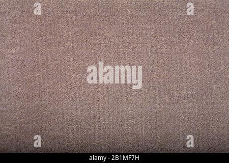 Carpet covering background. Pattern and texture of light brown colour carpet. Copy space. Stock Photo