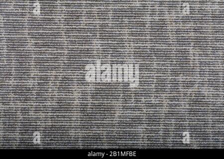 Carpet covering background. Pattern and texture of gray colour carpet. Copy space. Stock Photo