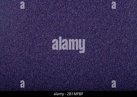 Carpet covering background. Pattern and texture of dark blue colour carpet. Copy space. Stock Photo