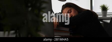 Tired woman in office Stock Photo