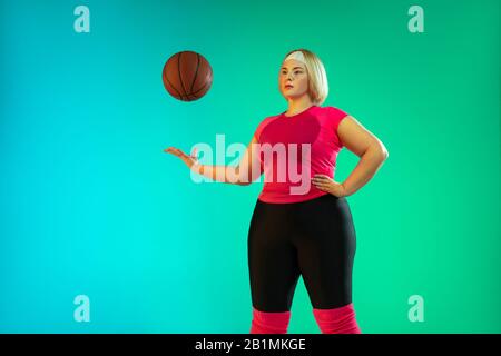 Woman with basketball in sport concept Stock Photo - Alamy