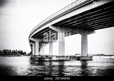 A view from the water under the highway. Stock Photo