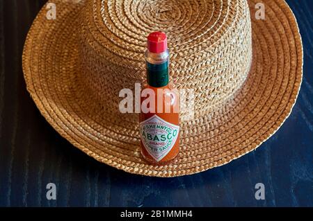 bottle of Tabasco sauce, spicy chilis, bright colors, red, blue Stock Photo