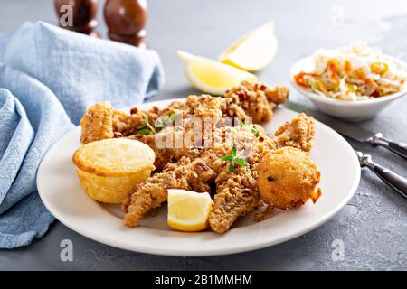 Southern fried fish with cornbread Stock Photo