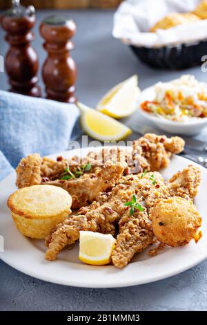 Southern fried fish with cornbread Stock Photo