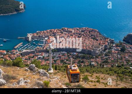 Cable car gondola in front of Old Town of Dubrovnik, Croatia, going up the mountain. Royalty free stock photo. Stock Photo