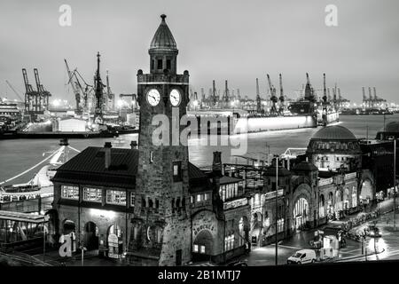 Landungsbrücken pier at sunset in Hamburg, Germany in black and white. Royalty free stock photo. Stock Photo