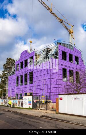 Siniat Weather Defence external sheathing board being installed on a new build Cambridge University building. Stock Photo