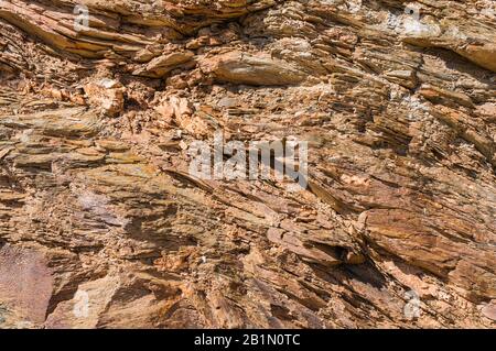 Natural background of brown layered sandstone. Rock on the seashore Stock Photo