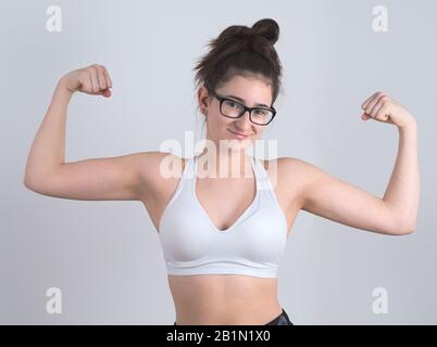 Young Bespectacled Teen Girl Posing in Sportswear Stock Photo