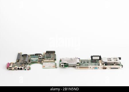 Comparing two laptop mother boards,  one  from 2003, one from 1999. Stock Photo