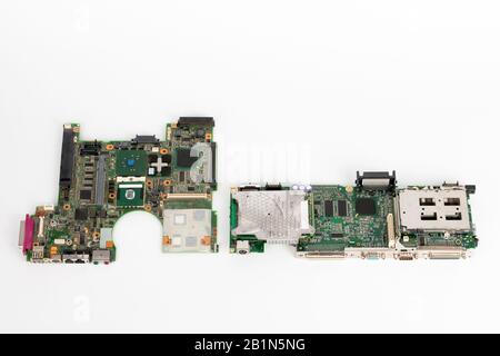 Comparing two laptop mother boards,  one  from 2003, one from 1999. Stock Photo