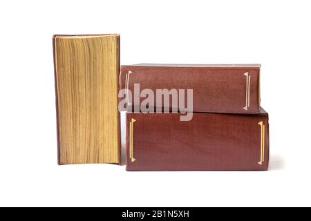 three old books with yellow pages isolated on white background Stock Photo