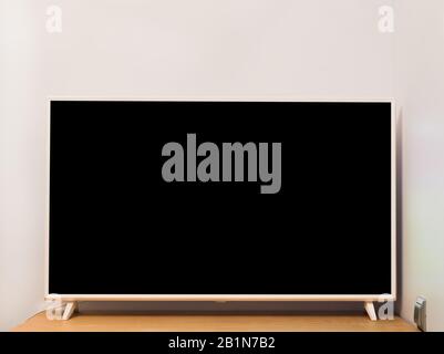 4k TV off on table Stock Photo