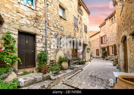 A charming, picturesque back street in the medieval walled village of Tourrettes-Sur-Loup in the Alpes-Maritimes area of Southern France. Stock Photo