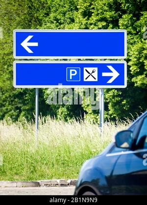 blue direction sign at a junction, Germany, Bavaria Stock Photo