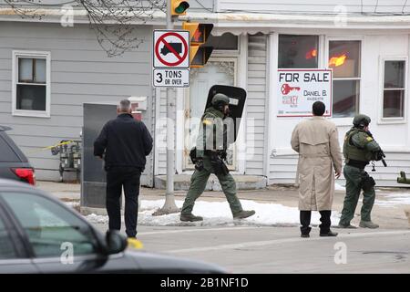 Milwaukee, Wisconsin, USA. 26th Feb, 2020. Police move in to secure the area after a mass shooting incident. In one of the worst shootings in Wisconsin history, six people were killed during a shooting rampage on the Milwaukee campus of Molson Coors on Wednesday afternoon. Credit: Pat A. Robinson/ZUMA Wire/Alamy Live News