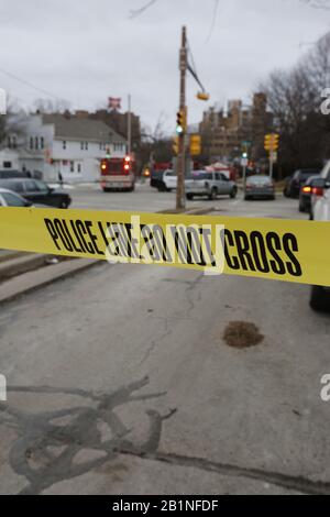 Milwaukee, Wisconsin, USA. 26th Feb, 2020. Yellow police tape around the secure area after the shooting. In one of the worst shootings in Wisconsin history, six people were killed during a shooting rampage on the Milwaukee campus of Molson Coors on Wednesday afternoon. Credit: Pat A. Robinson/ZUMA Wire/ZUMAPRESS.com/Alamy Live News