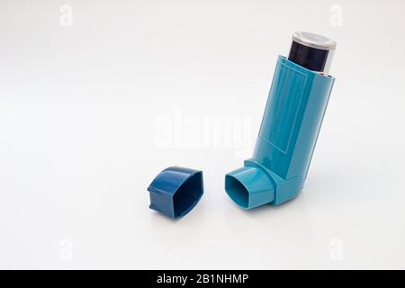 Open asthma inhaler on a white background Stock Photo