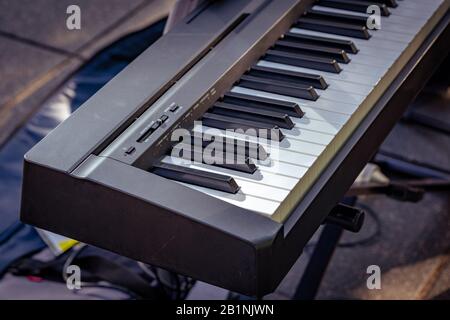 Busker's synthesizer keyboard closeup outdoors Stock Photo