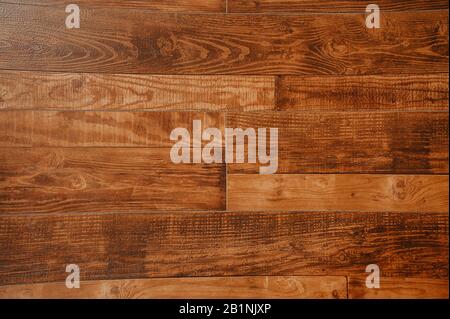 homogeneous floor of beautiful lacquered wood dark parquet with wood pattern Stock Photo