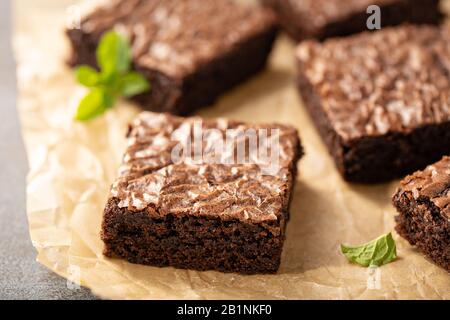 Freshly baked brownies on a parchment paper Stock Photo
