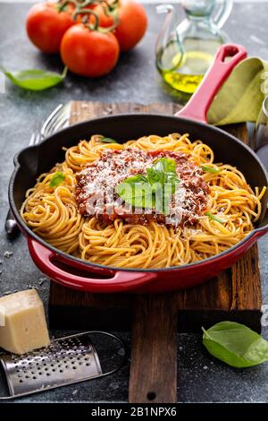 Spaghetti Bolognese in a cast iron pan Stock Photo