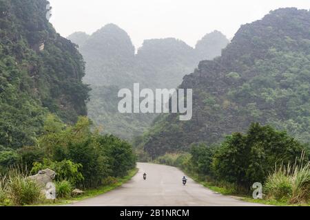 Vietnam Trang An Landscape Complex - Limestone (karst) massifs of Trang An in Ninh Binh Province of North Vietnam, Southeast Asia. Stock Photo