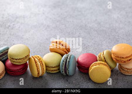 Variety of colorful macarons on the table Stock Photo