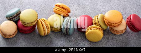 Variety of colorful macarons on the table Stock Photo