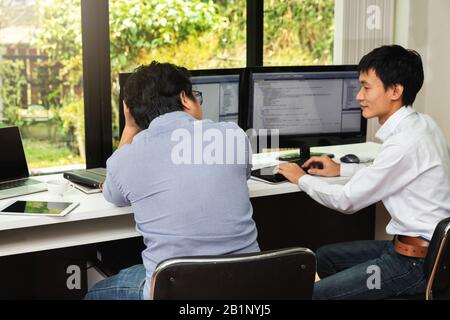 Programmers team working in a software developing. Developing programming and coding technologies. Website design. Cyber space concept. Stock Photo