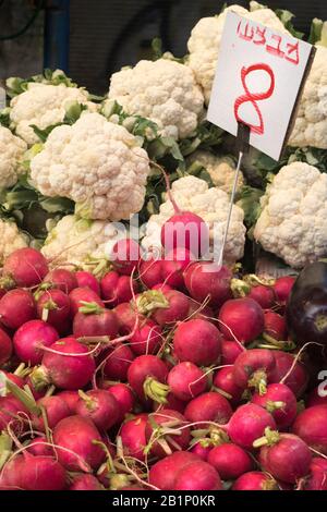 Radishes and cauliflower for sale in Carmel Market (Shuk HaCarmel), the largest market in Tel Aviv, Israel Stock Photo