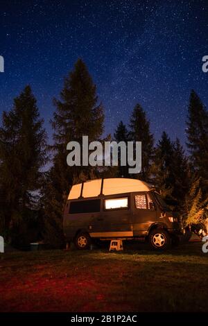 Camper van under starry sky Stock Photo - Alamy