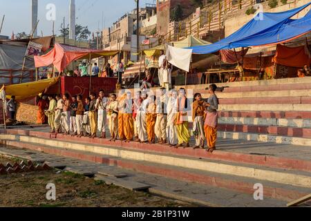 Young hindu priests on Ghats in morning. Varanasi. India Stock Photo