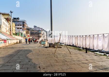 Laundry drying on rope on Ghat in sunny day . Varanasi. India Stock Photo