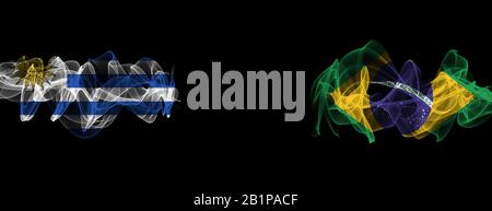 Flags of Uruguay and Brazil on Black background, Uruguay vs Brazil Smoke Flags Stock Photo