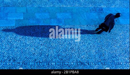 Lisbon, man with long shadow Stock Photo