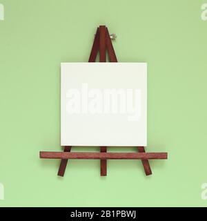 Wooden easel with blank canvas on green background. top view, copy space Stock Photo