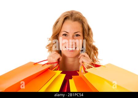 Cutwe brunette woman with curly brown hair holding shopping bags isolated over white Stock Photo