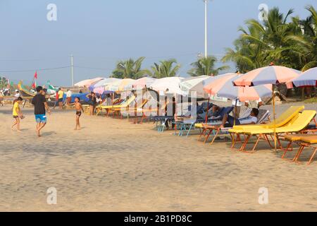 Kerala, India, December 2017, Tourist on bathing decks at Kovalam Beach Stock Photo