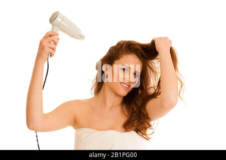 beautiful young woman dries hair  with a blow dryer Stock Photo